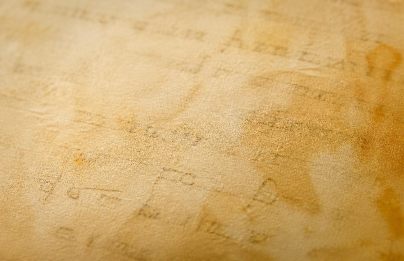 An aged parchment texture in warm light
